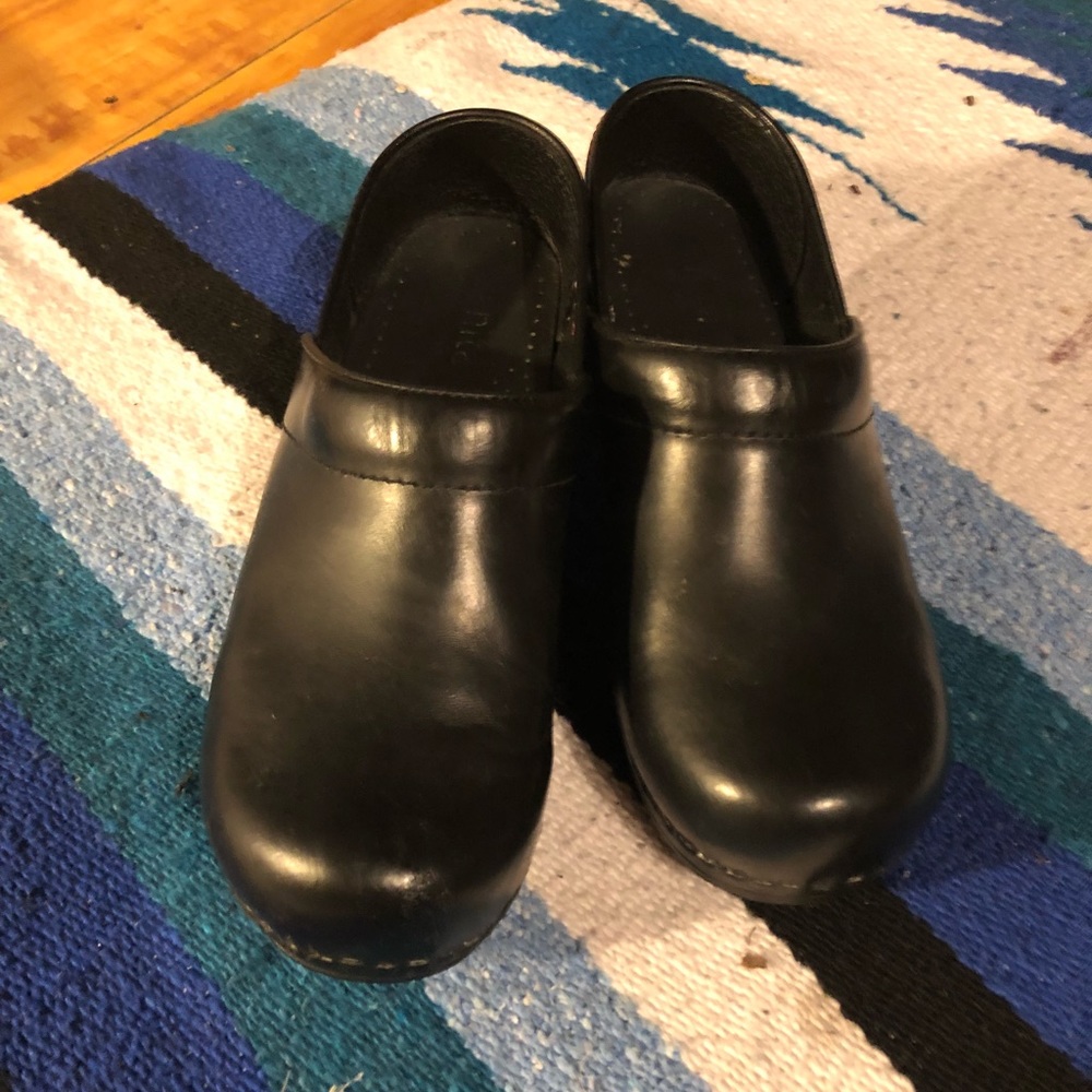 Sanita clogs.